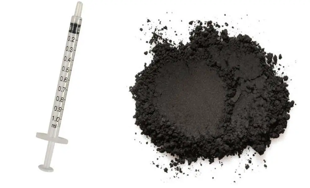 Syringe and activated charcoal for bearded dragon